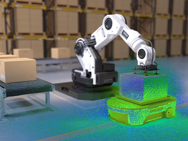Robotic arm placing a box onto an autonomous mobile robot in a warehouse.