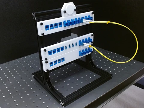 Fiber optic patch panels with a yellow loopback cable.