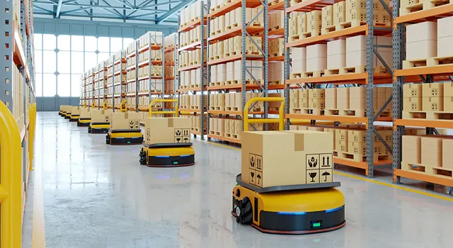Automated warehouse with robots carrying boxes.