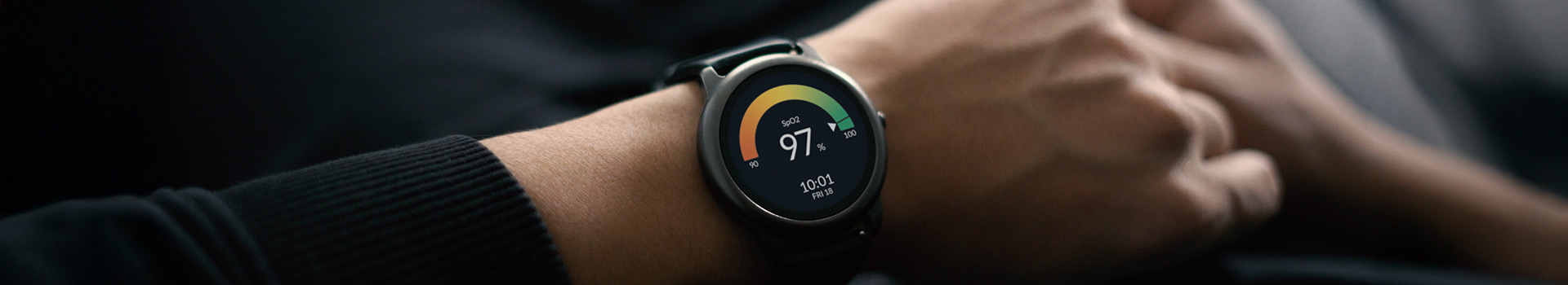 Smartwatch on wrist showing 97% SpO2 reading.