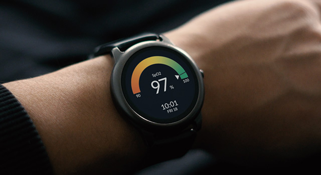Smartwatch on wrist showing 97% SpO2 reading.