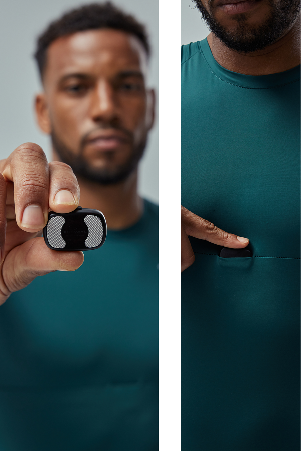 A man holding the Prevayl Sensor and placing it inside SmartWear