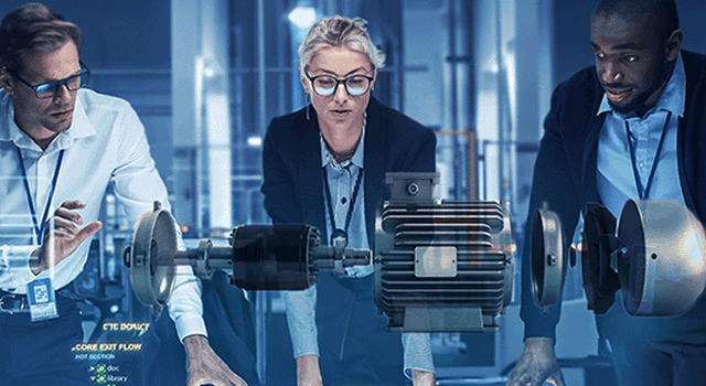 Three people looking at a holographic image of a variable speed drive motor