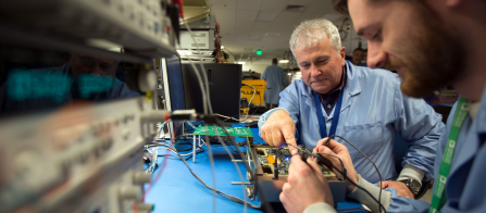 Two engineers testing a component