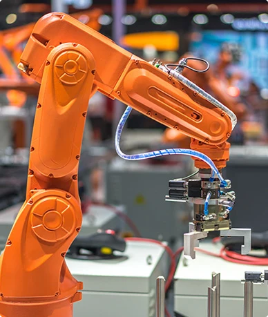 Orange industrial robot arm with metal gripper.