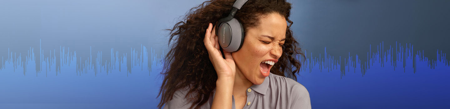 Woman signing while wearing headphones and an audio signal graphic displays in the background.