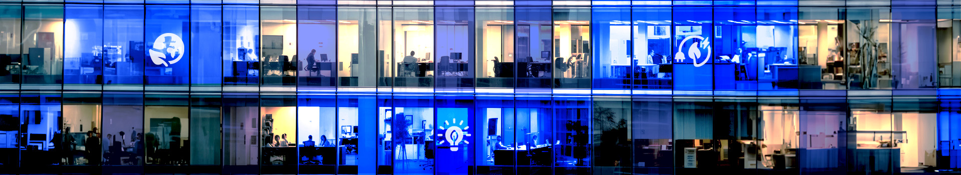 Hero image showing 2 stories of offices overlayed with green energy related icons