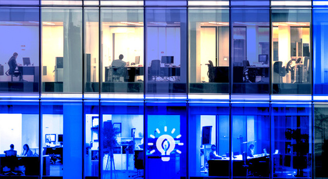 Hero image showing 2 stories of offices overlayed with green energy related icons