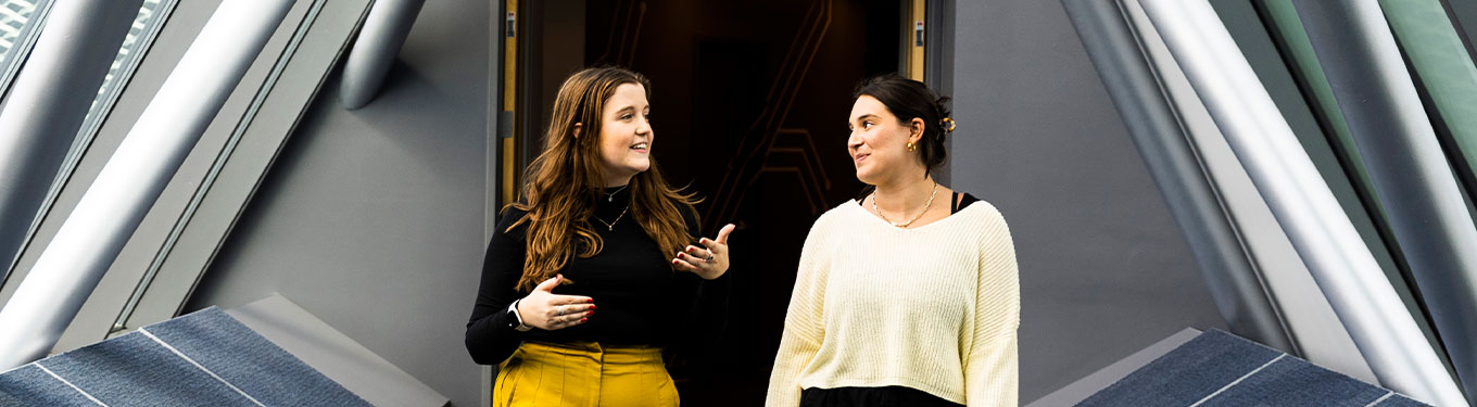 Two girls talking in the Hub connector