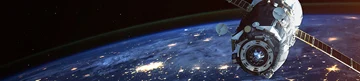 Nighttime Earth with satellite against sunrise. Nighttime Earth with satellite against sunrise.