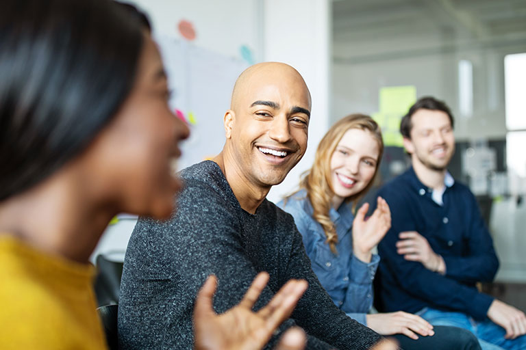 Group of people talking and laughing