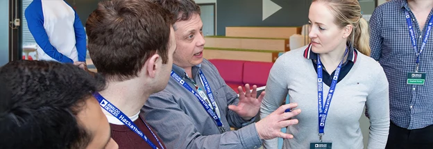 Advisor explains strategy to team members