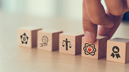 Core values icon on flat wood cube