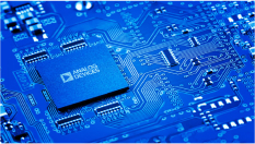 Close up of an electronic circuit board with an Analog Devices chip carrier.