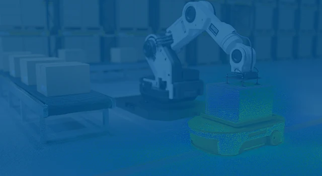 Robotic arm placing a box onto an autonomous mobile robot in a warehouse.