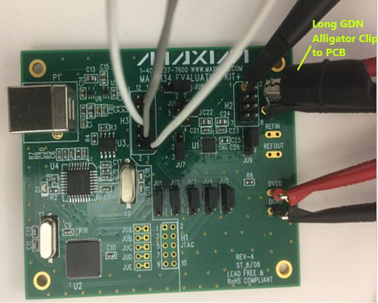 Figure 10.  MAX5134 glitch impulse measurement using a standard scope probe with a long alligator clip ground connection to the PCB.