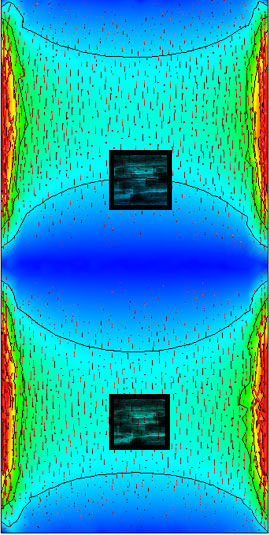 Figure 3. Simulation of PCB resonance and inertial sensor placement. The sensor in the lower nodal area is where resonant-associated angular rate signals are mitigated. The second sensor above is in an unbalanced position and more prone to acceleration and angular rate signal corruption. The PCB image is copyrighted and provided courtesy of FEKO.