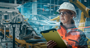 Graphic image shows a female technology worker in a factory setting reviewing technical data on tablet device. 