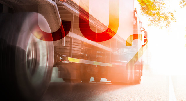 A semi-trailer truck riding through a bright future on a highway