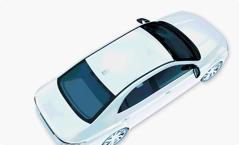 Overhead animation of a white car transitioning from solid to transparent, showing internal components.