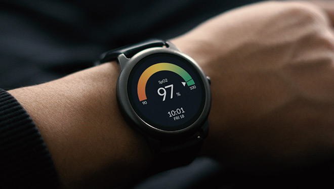 Smartwatch on wrist showing 97% SpO2 reading.