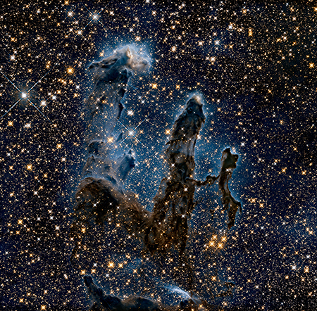 Image shows an outer space Nebula called The Eagle Nebula. Image was captured in the Infrared Light spectrum.