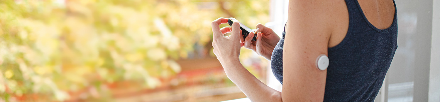 A woman checking her blood glucose levels.