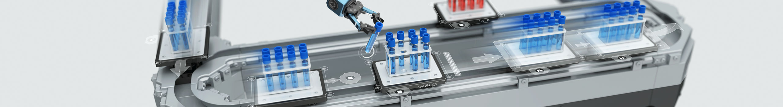 Intelligent conveyance system transporting test tubes filled with blue liquid.