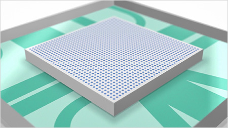 3D model of a grey silicon chip on a green surface