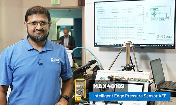 Engineer demonstrating the MAX40109 Intelligent Edge Pressure Sensor AFE with real-time measurement on screen