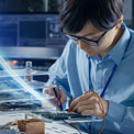 Engineer working on circuit board