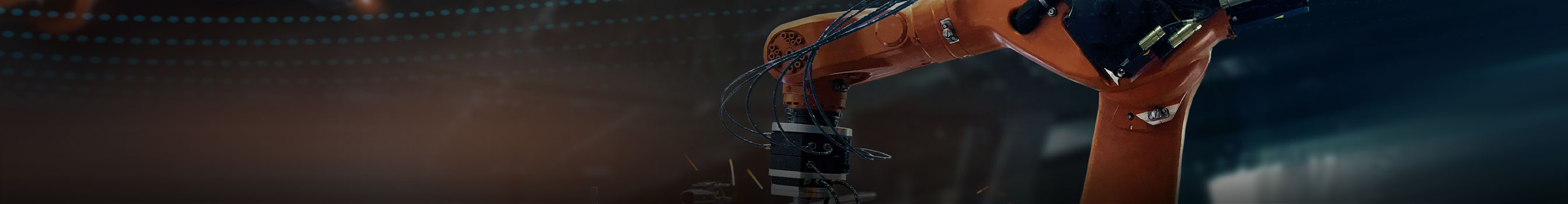 Robotic arm welds in a machine factory