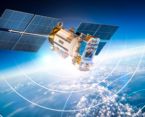 Satellite in outerspace above Earth with relay signals.